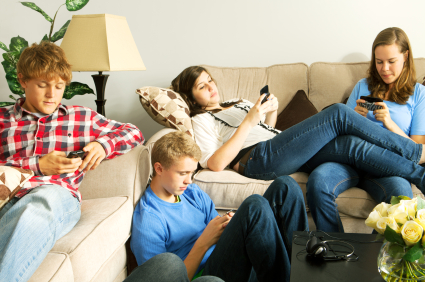 Teens distracted by their cell phones.