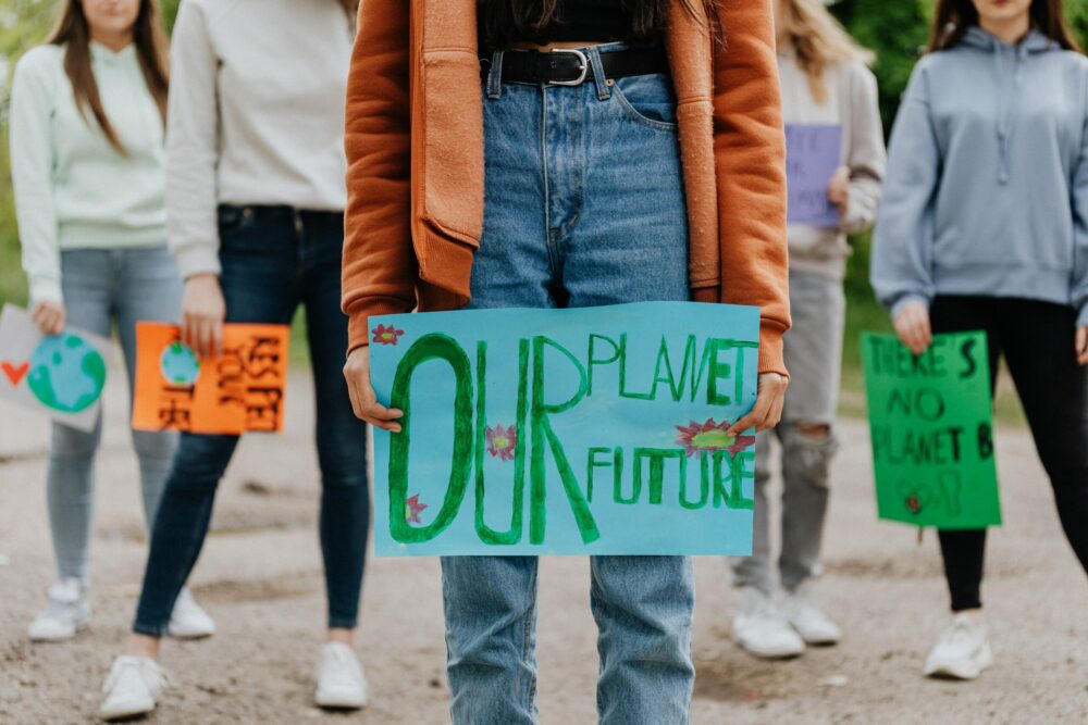 Climate activist holding a banner
